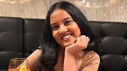 student Gauri Bharadwaj smiling towards camera 