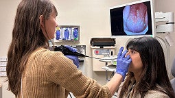 Sierra Corbin and student in a clinical setting