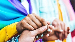 multiple hands holding onto each other