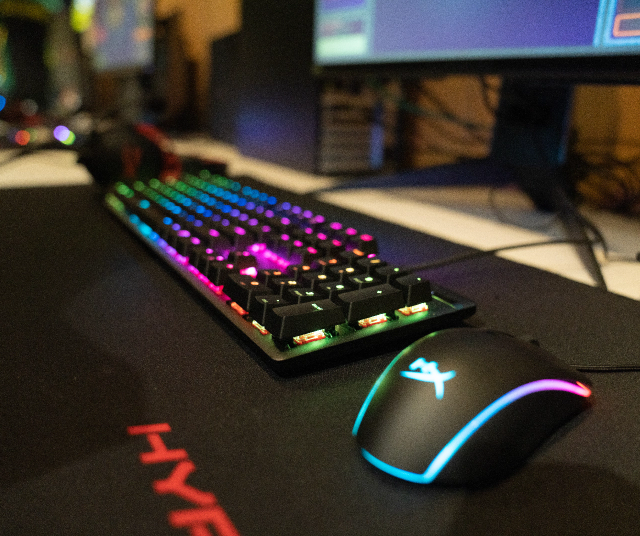Illuminated keyboard and mouse inside the Esports Lounge.