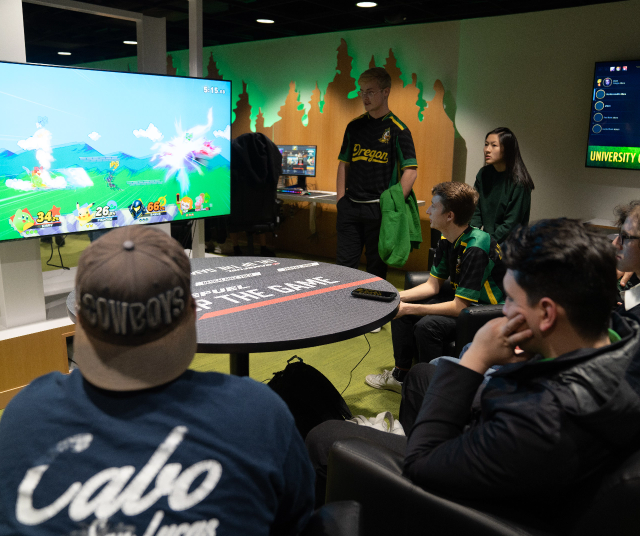 Students playing smash brothers at the Esports Lounge.