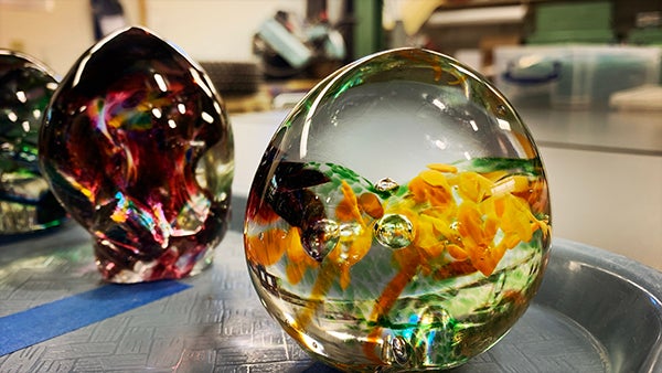 Multicolored glass eggs on a table