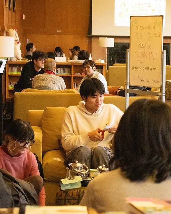 Students gather in a lounge for crafts projects