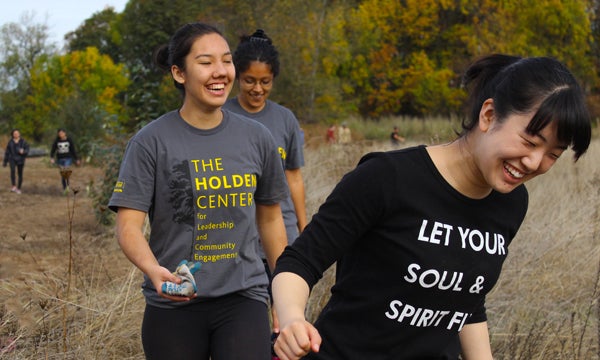 Students organized through Holden Center conducting nature area cleanup.