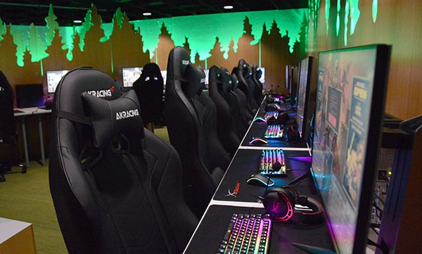 Esports Lounge featuring gaming chairs and several gaming computers.