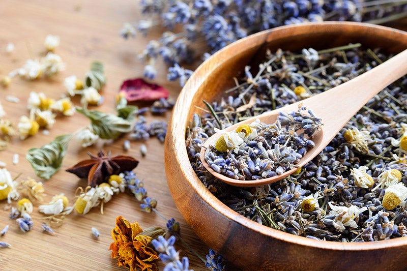 Dried lavender in a wooden bowl.