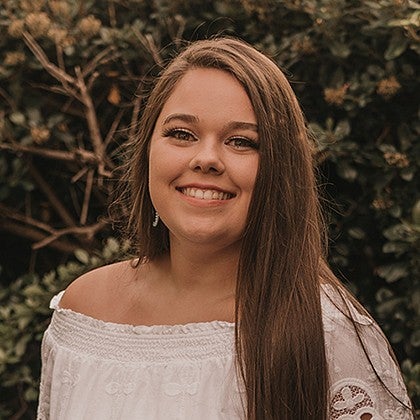 portrait of daisy o'hearn with leafy background