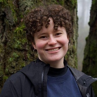portrait of camila hess neustadt in front of a waterfall