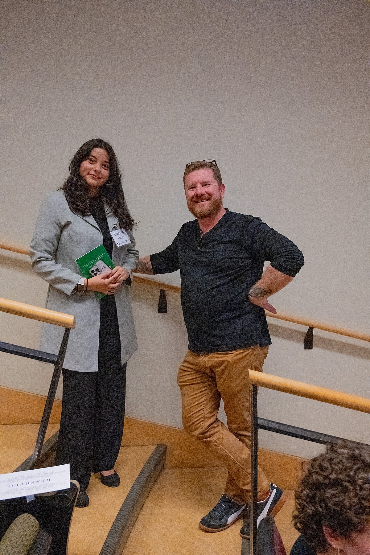 a presenter and their thesis advisor posing at three minute thesis