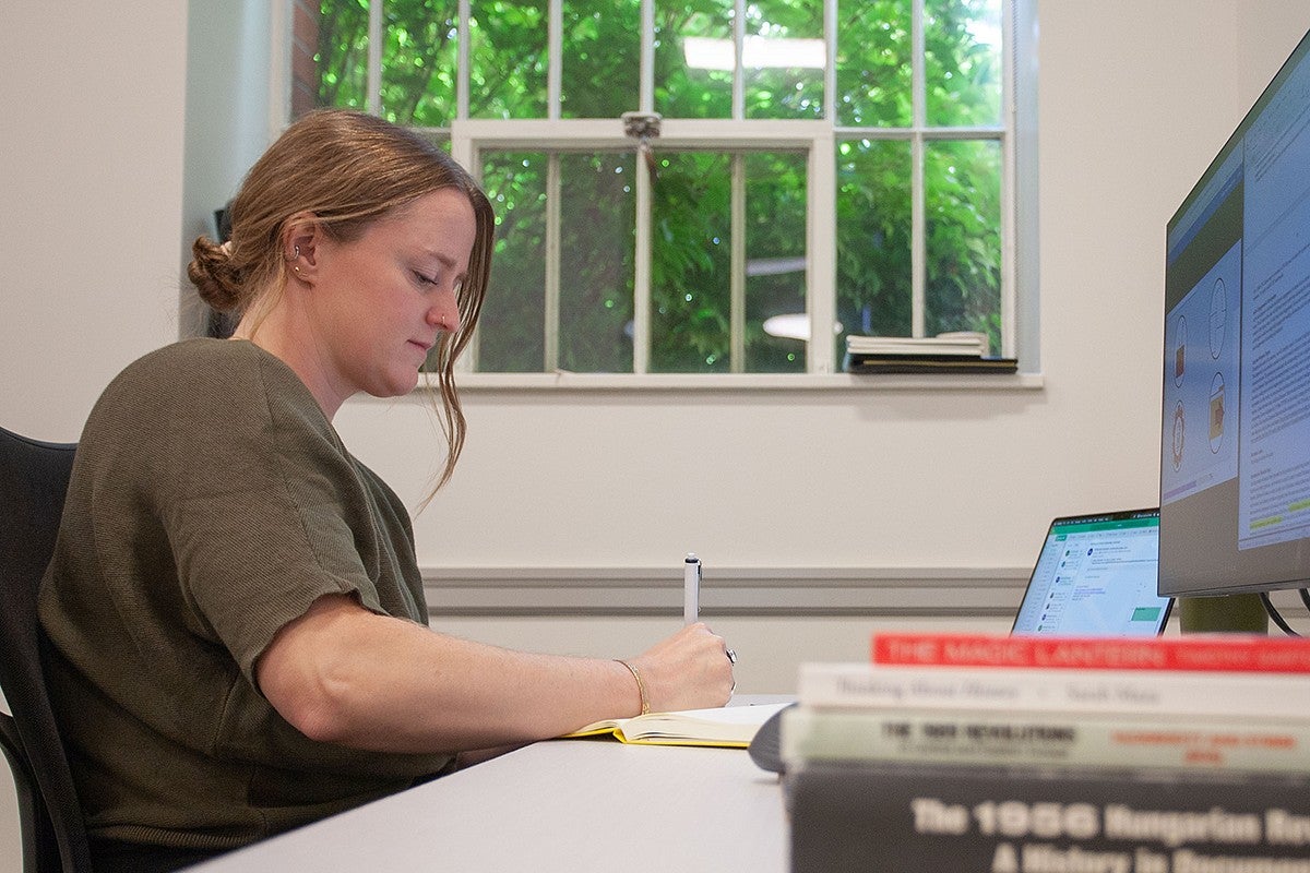larissa stiglich at the desk in her Chapman office