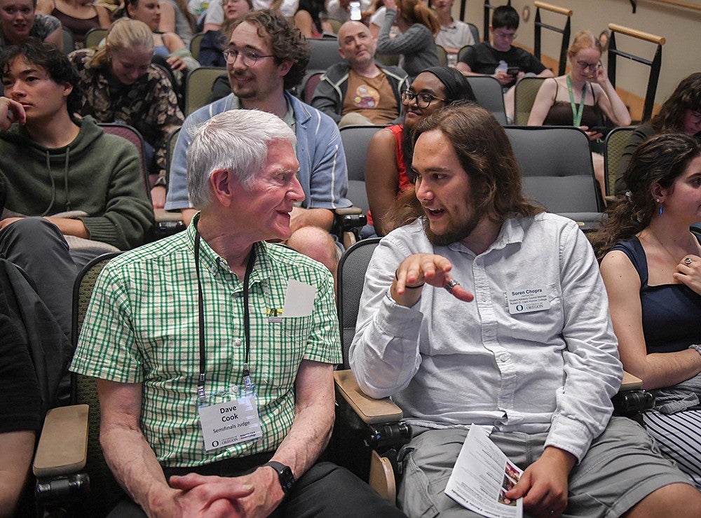 audience members talking at three minute thesis