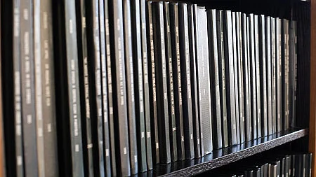 Thesis books on a shelf