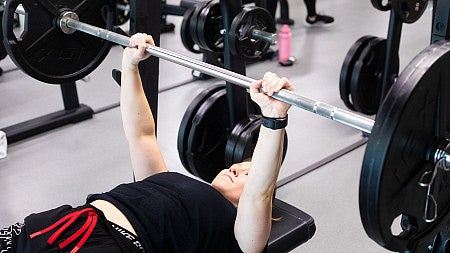 Grace Winjum lifing barbells.  