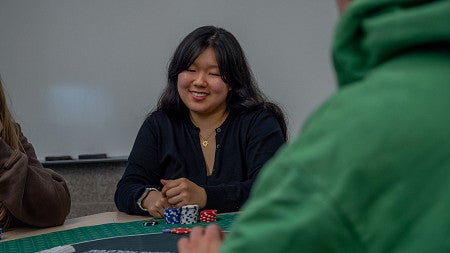 student playing poker in classroom