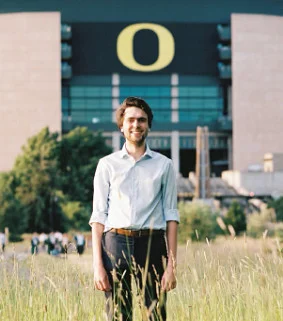 Jakob Hollenbeck (2022) standing in front of Autzen Stadium