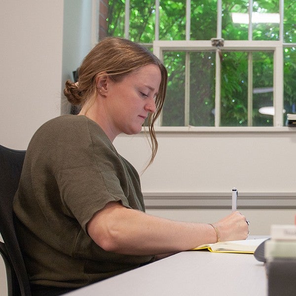 larissa stiglich at the desk in her Chapman office
