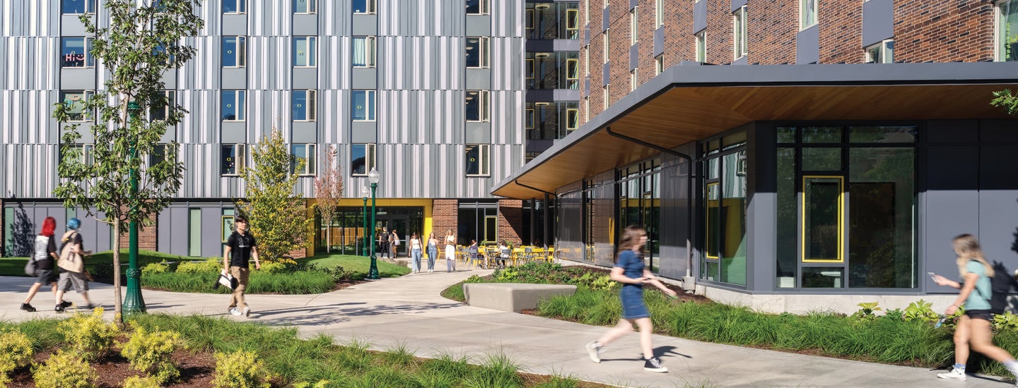 Students walking through courtyard of Yasui Hall.