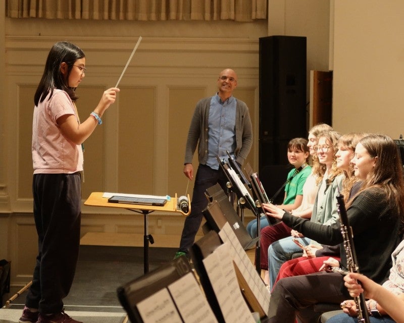 child conducting UO wind ensemble