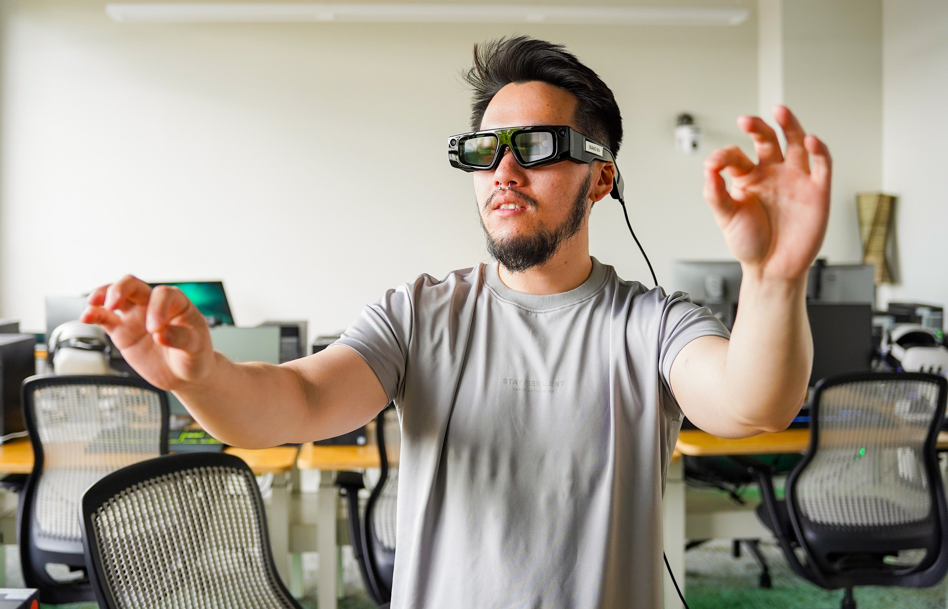 Students using VR and AR equipment in the Oregon Reality Lab at the UO Portland campus