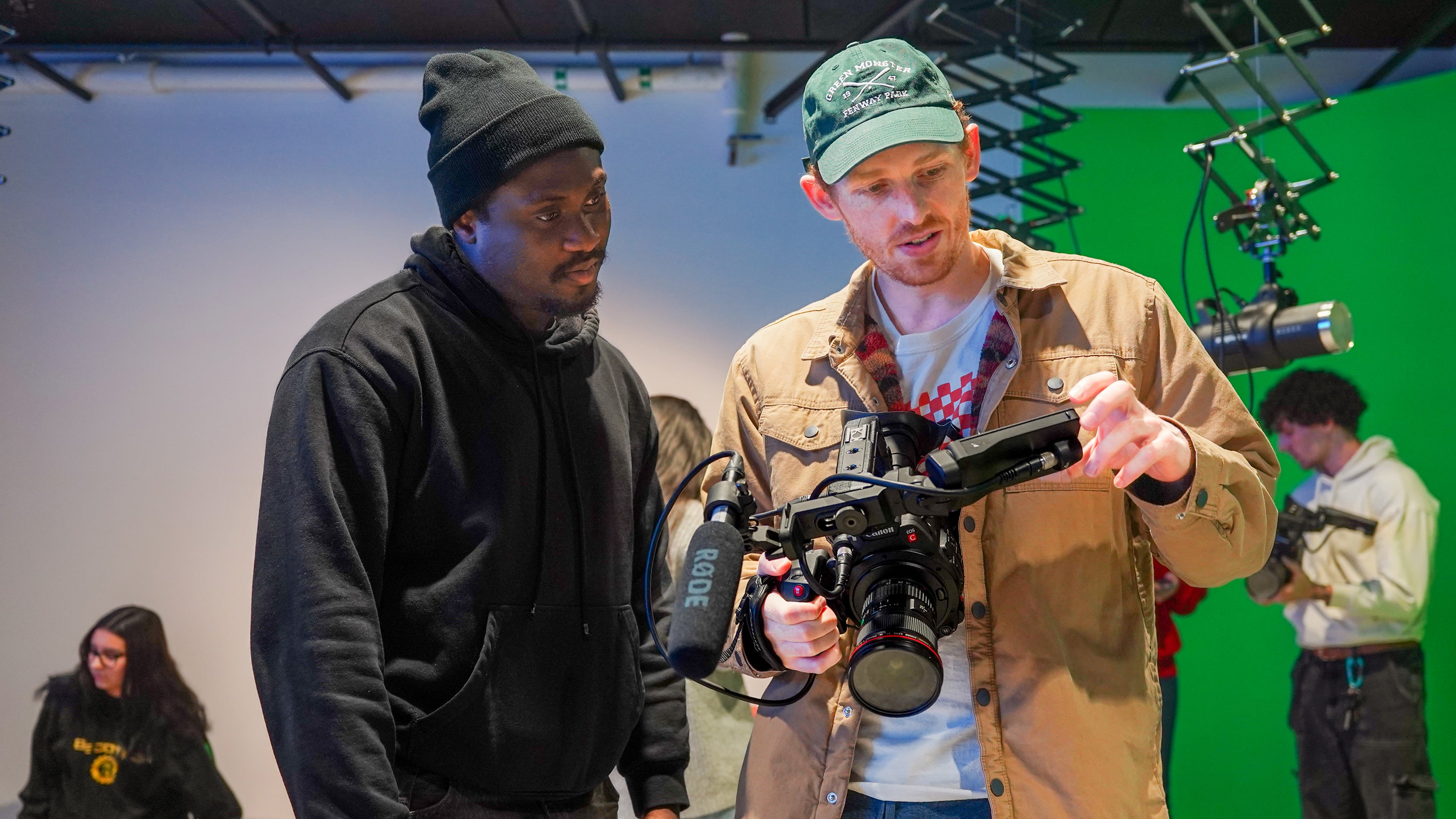 Students in the University of Oregon Multimedia Storytelling Master’s program explore video equipment in a production studio
