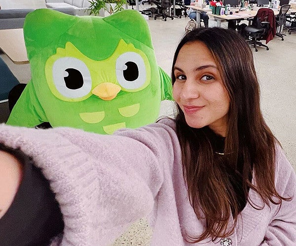 Zaria Parvez takes a selfie with Duo, the (in)famous green Duolingo owl