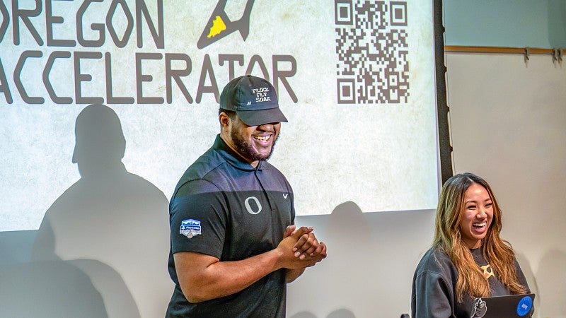 Oregon Accelerator student present in front of a screen