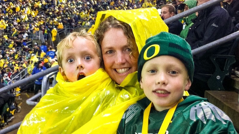 Tonya Dressel attends an Oregon football game at Autzen Stadium with two children