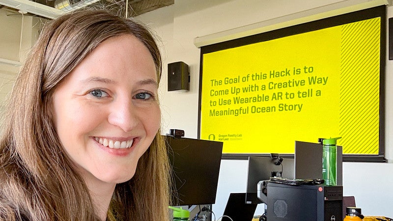 portrait of Kathleen Darby, an immersive media communication master’s alum, taken in the Oregon Reality Lab