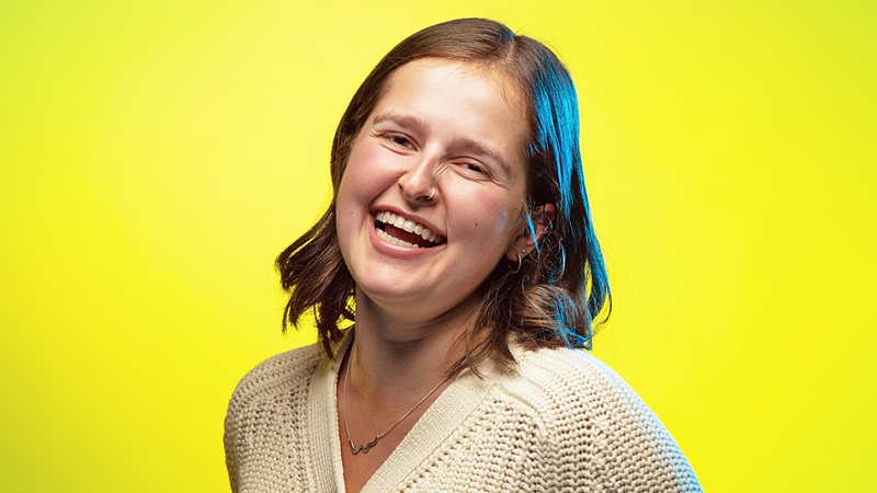 portrait of Eliza Lawrence on a vivid yellow background