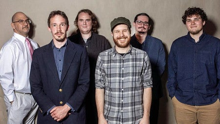 group of white men smiling