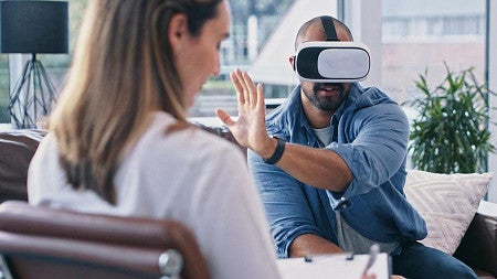 A person wearing a VR headset during a talk therapy session