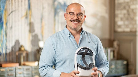 Wesley Della Volla holds a VR headset