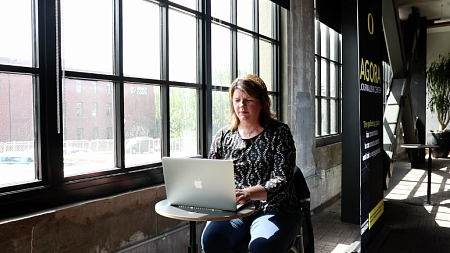 Jules Walters, strategic communications master's student, working inside the Portland White Stag Block