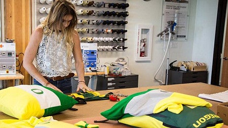 Scott Hamlin upcycling University of Oregon uniforms. 
