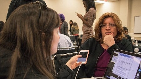Women holding cell phone