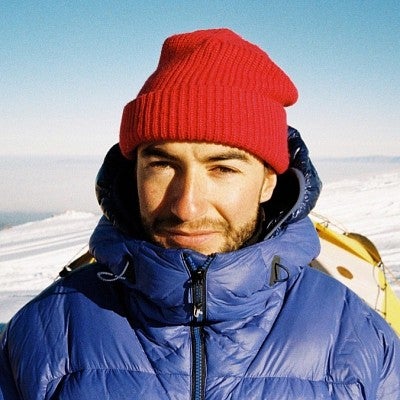 portrait of Will Saunders wearing a red knit cap