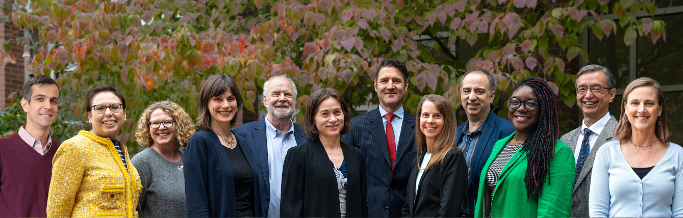 Oregon Law business law faculty members in the law school courtyard