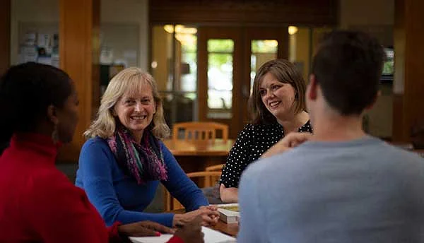 People sitting around a table talking