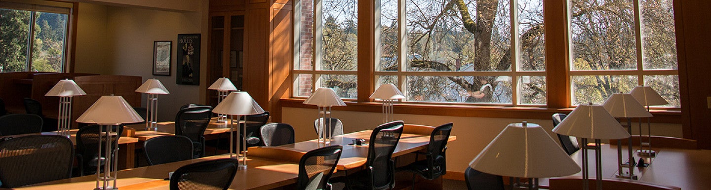 photo of sunlight coming through the law library window onto empty desks