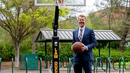 Oregon Law Professor David P Weber Stands with a Basketball