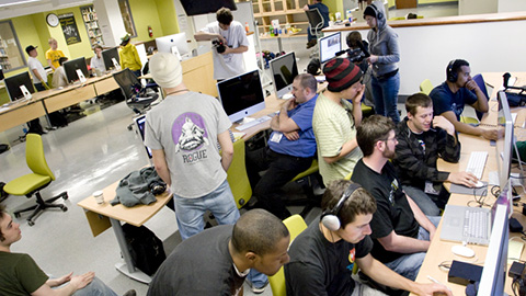 A group of students working collaboratively in a computer lab.
