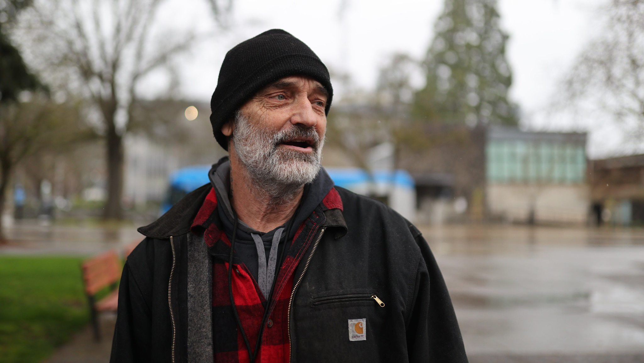 Portrait of Tim Lewis wearing layered winter clothing and beanie cap.