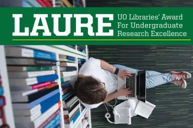 UO Libraries' Award for Undergraduate Research Excellence (LAURE) student sitting on the floor near a bookshelf