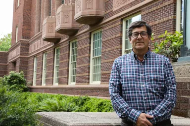Jeff Staiger standing on front steps of Knight Library.