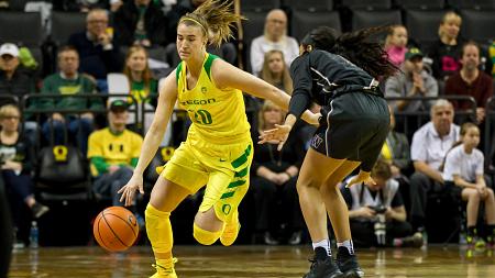Sabrina Ionescu (#20) driving around a defender during a game against Washington on December 31, 2017. 