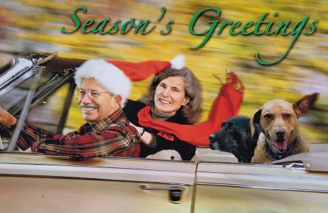 Season's Greetings card with Peter DeFazio, his wife Myrnie and two Labrador retrievers riding in a car.