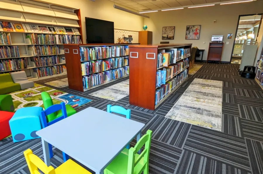 Portland Library room 201 displaying children's seating, books on shelves, and artwork