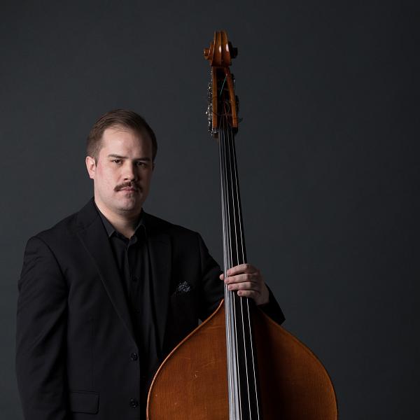 James P. Daley holding upright bass