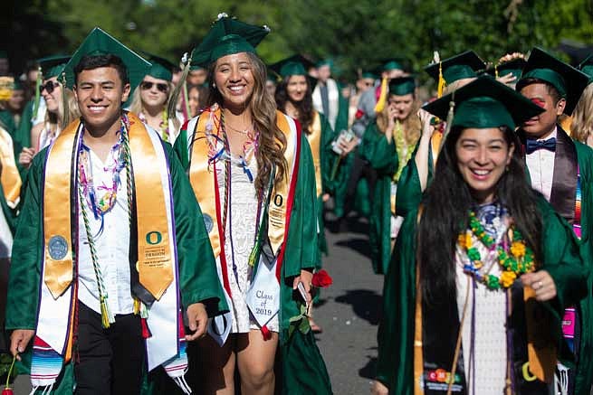 Students walking in the Duck Grad Parade