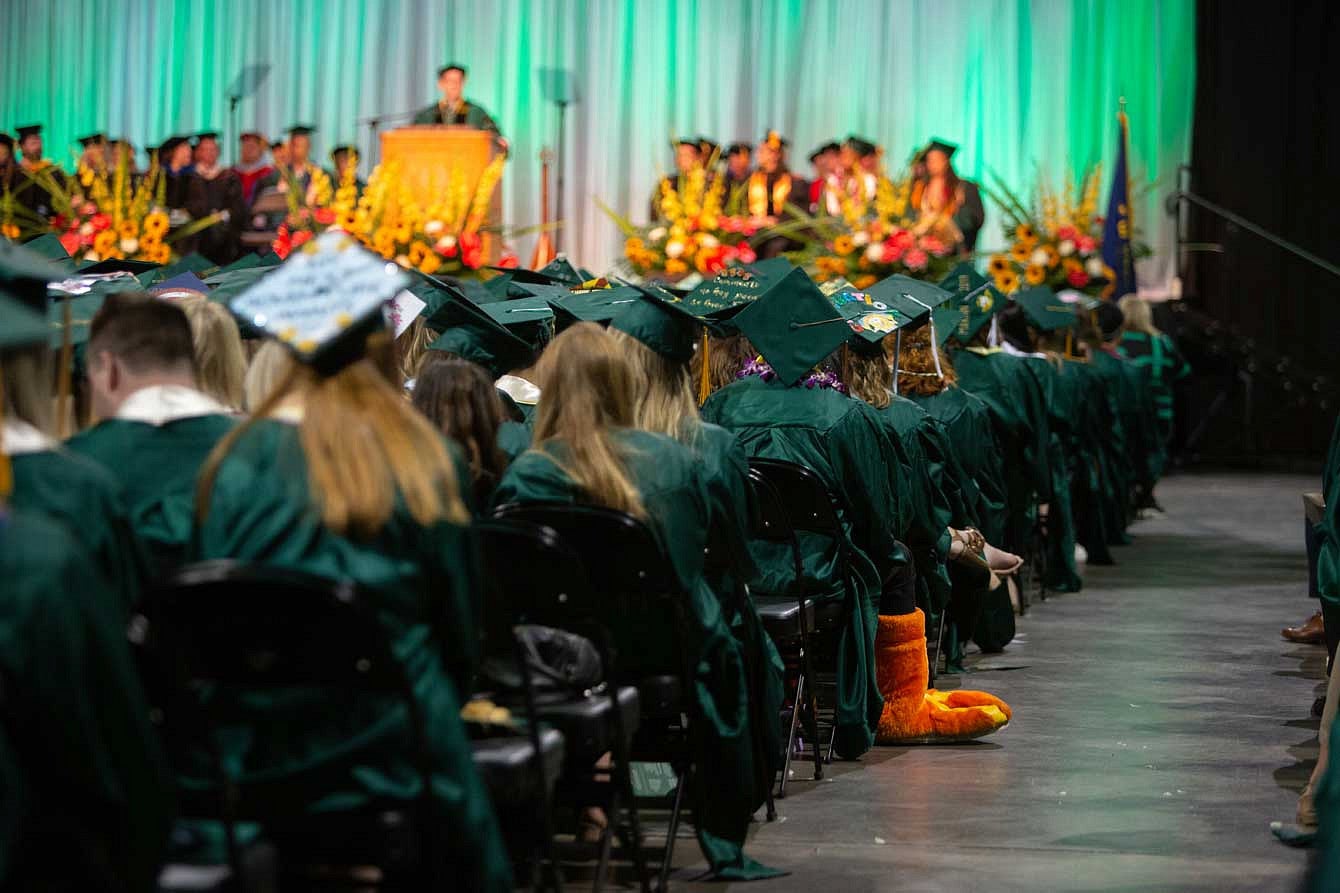 Graduates watching the ceremony during President Schill's speech